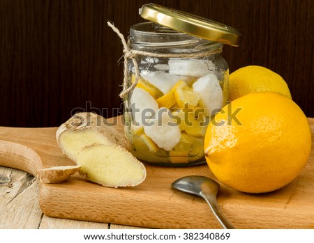 Lemon and ginger for tea on a wooden background