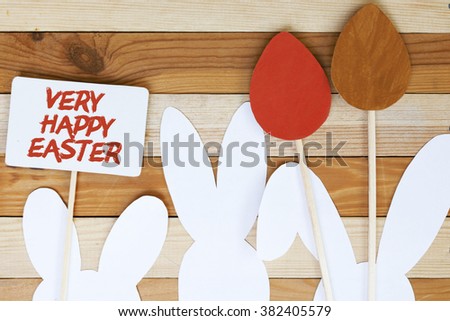Happy Easter paper Rabbit Bunny Easter egg and poster on wooden Background