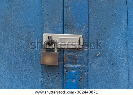 door lock on blue door Royalty-Free Stock Photo #382440871
