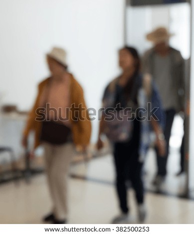 blurred background. people walking on a city street