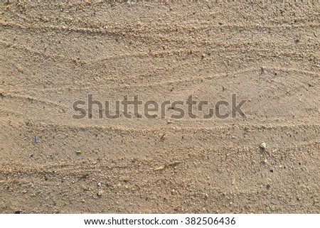 Lines of sand on the beach Royalty-Free Stock Photo #382506436