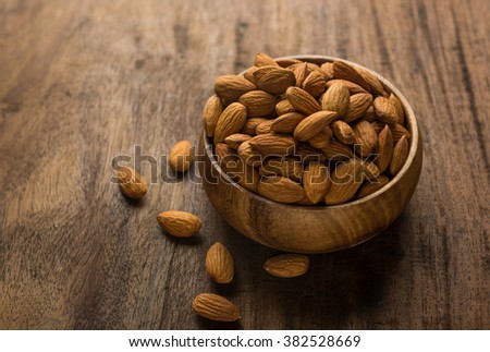Cleaned almonds in a wooden bowl
