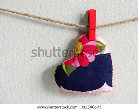 heart symbol hanging wit rope