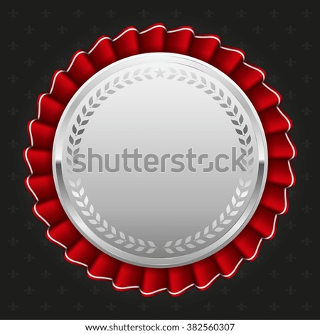 Glossy silver badge on black background
