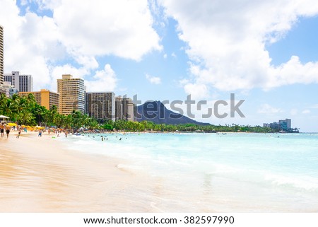 Gorgeous beach view with buildings and diamond head cliff on the island of Oahu, Hawaii.