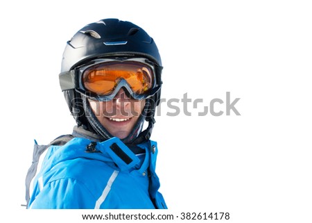 Portrait of smiling man in the blue skiing jacket, helmet and glasses against white background with copy space