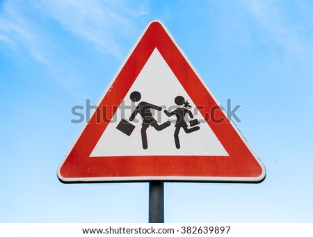 Road sign caution children over blue sky background