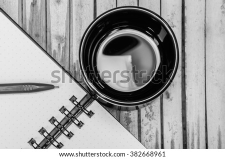 Hot Coffee Cup and Notebook and pen.