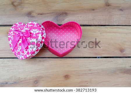 Colorful heart gift box on wood table