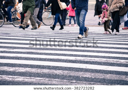 people crossing the road in japan