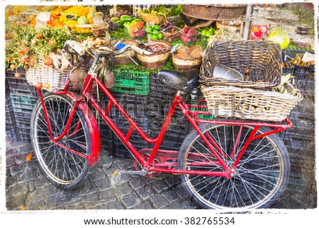 retro red bike in fruit market in Rome, artistic picture