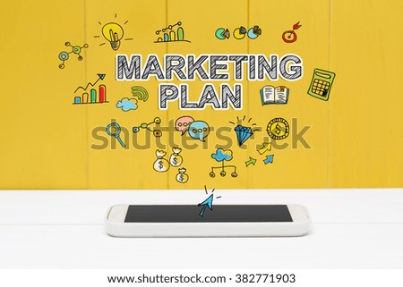 Marketing Plan concept with smartphone on yellow wooden background