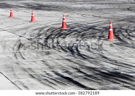 Abstract texture and background black tire tracks skid on asphalt road, Wheel tire tracks background, Car tire track skid mark on race track background, Aerial view, View from above.
