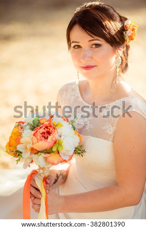 Beautiful bride in white dress in the garden