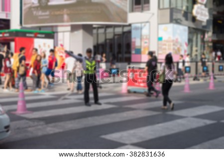 Busy big city street people on zebra crossing