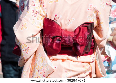 Red Munsuko and Pink pastel Yukata, Girl wear yukata walk in Japan temple.