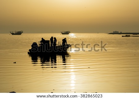 Silhouette of fishermen going for fishing early morning - Bahrain 