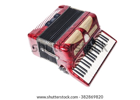 Old red accordion isolated on a  white background