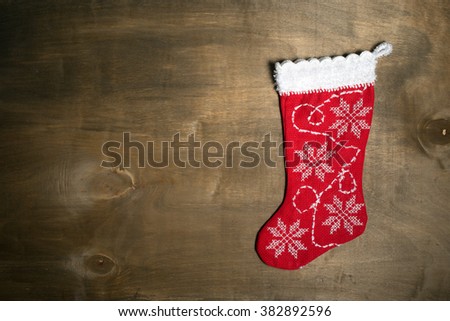 Handmade christmas stocking on wood background