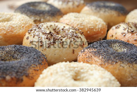 Baked authentic bagels with poppy seeds, sesame seeds and flax seeds
