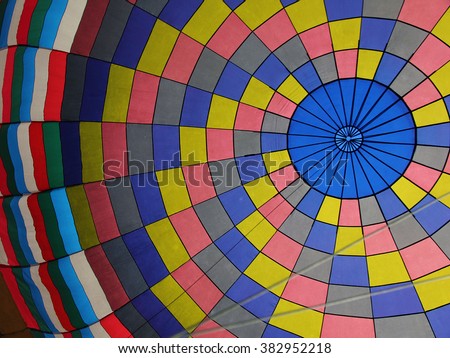 A soft focus, peaceful picture of the colorful inside of a hot air balloon.