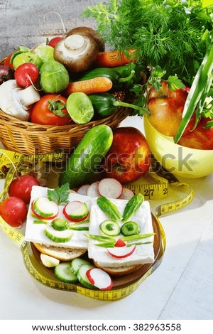 Funny sandwich in the shape of a rabbit with white cheese, cucumber and radish. diet sandwich