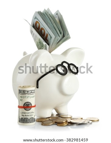 Piggy bank in glasses with dollars and coins isolated on white