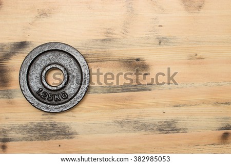 Weight on the wooden background