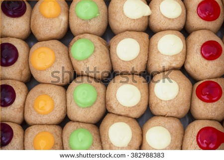 many donuts in multi color filling