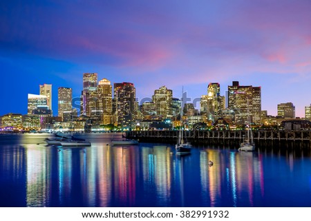 Boston downtown skyline panorama with skyscrapers over water at twilight