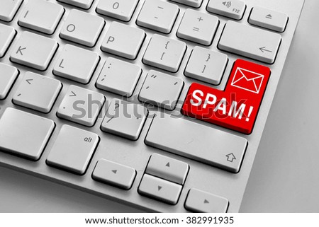 Computer keyboard with red spam email email button