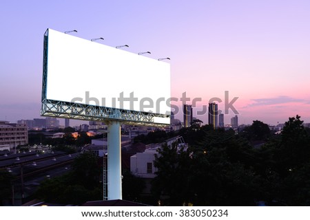 Blank billboard for advertising with cityscape sunset background.