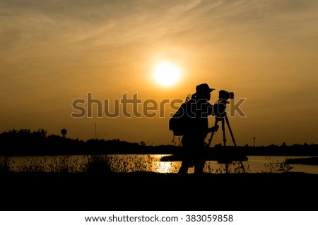 Silhouette of photographer during the sunset.