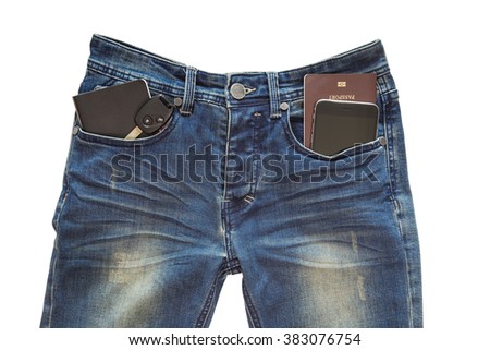 Mobile phone,passport book,car key,note book in blue jeans pocket/ traveling concept,clipping path