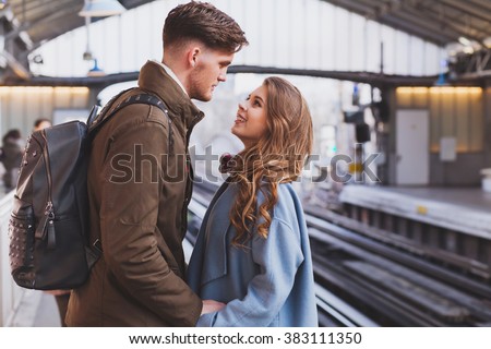 long distance relationship, couple on platform at the train station, meeting or parting concept Royalty-Free Stock Photo #383111350
