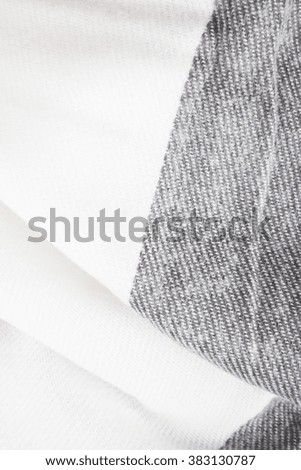 gray woolen cloth on a wooden background