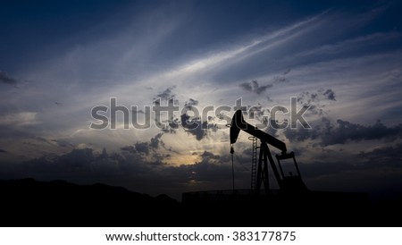Silhouette of crude oil pump in oil field at bahrain
