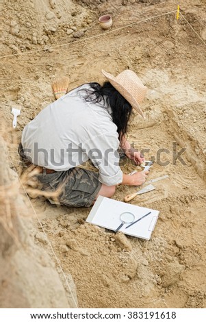 Archeaologist working on site
