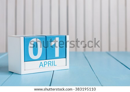 April 1st. Image of april 1 wooden color calendar on white background.  Spring day, empty space for text. All Fool's Day Royalty-Free Stock Photo #383195110