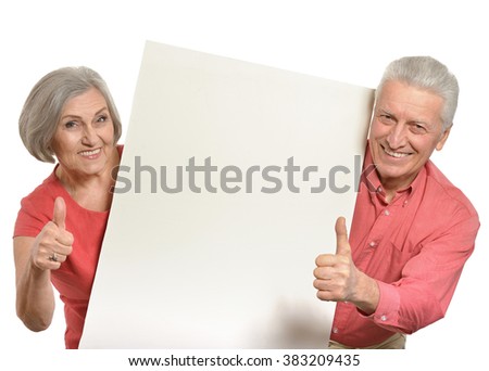 Old couple with board