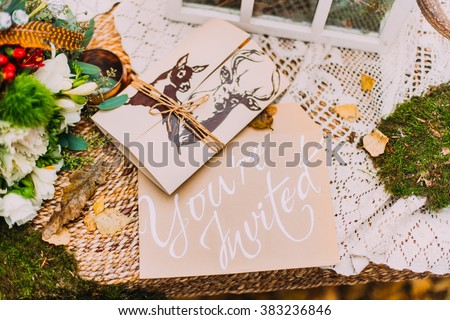 Wedding postcard invitation on the moss background close up