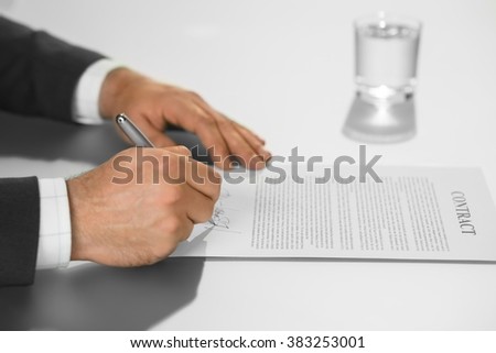Businessman is signing contract. Boss puts his signature. Boss ready to decide. Executive makes his move.