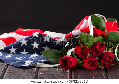 Rose and american flag on wood background Royalty-Free Stock Photo #383258863