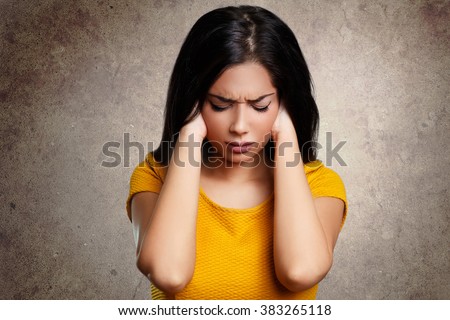 Stressed woman having a headache Royalty-Free Stock Photo #383265118