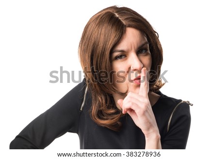 Brunette woman making silence gesture