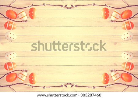 Easter eggs on wooden background. Soft vintage pastel colors picture.