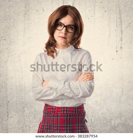 Teen student girl with her arms crossed