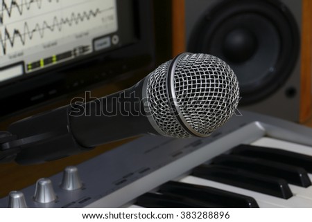Home recording studio. Screen keyboard, speakers and microphone.
