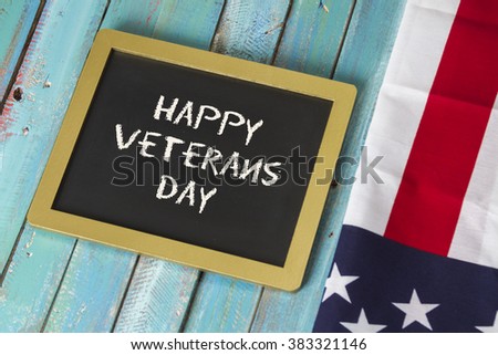 veterans day chalk sign on blue wood background
