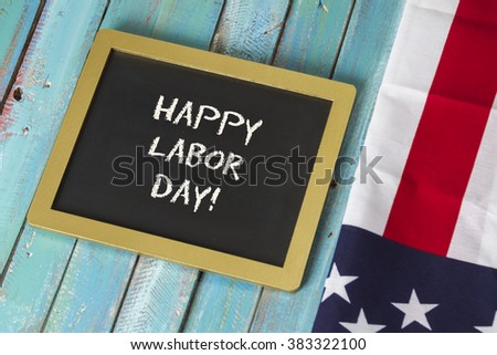 Labor Day chalk sign on blue wood background